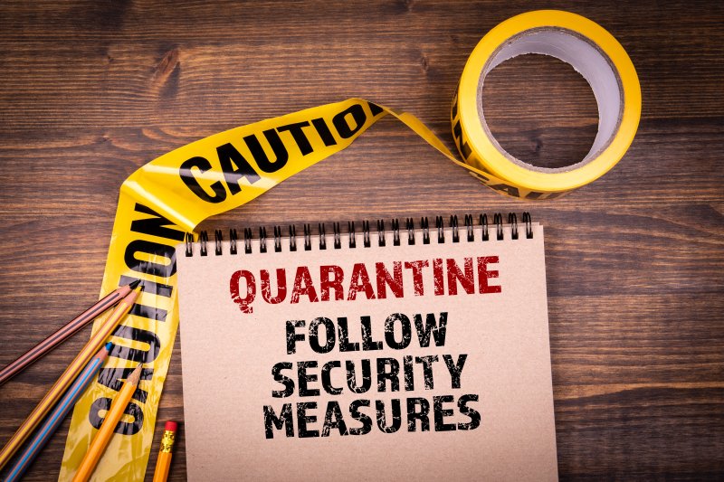 Quarantine. Follow security measures. Yellow plastic caution tape